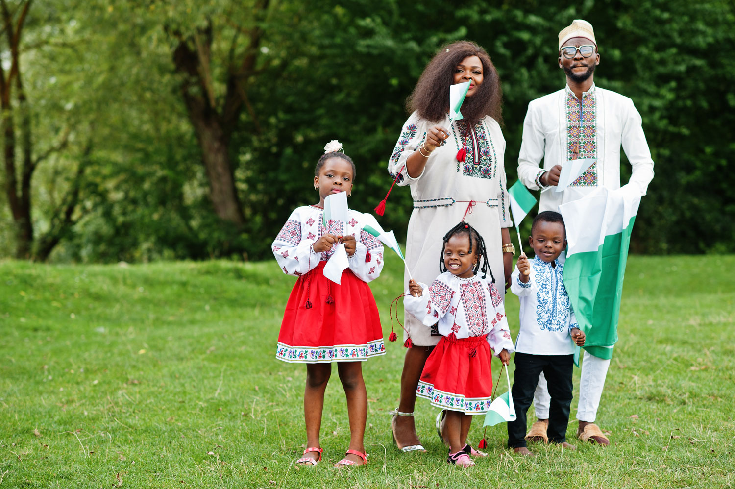 african-family-traditional-clothes-with-nigerian-flags-park0